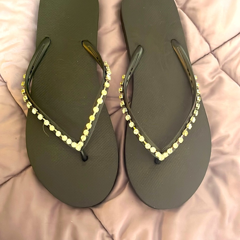 New without tags rhinestone flip flops. Size 11